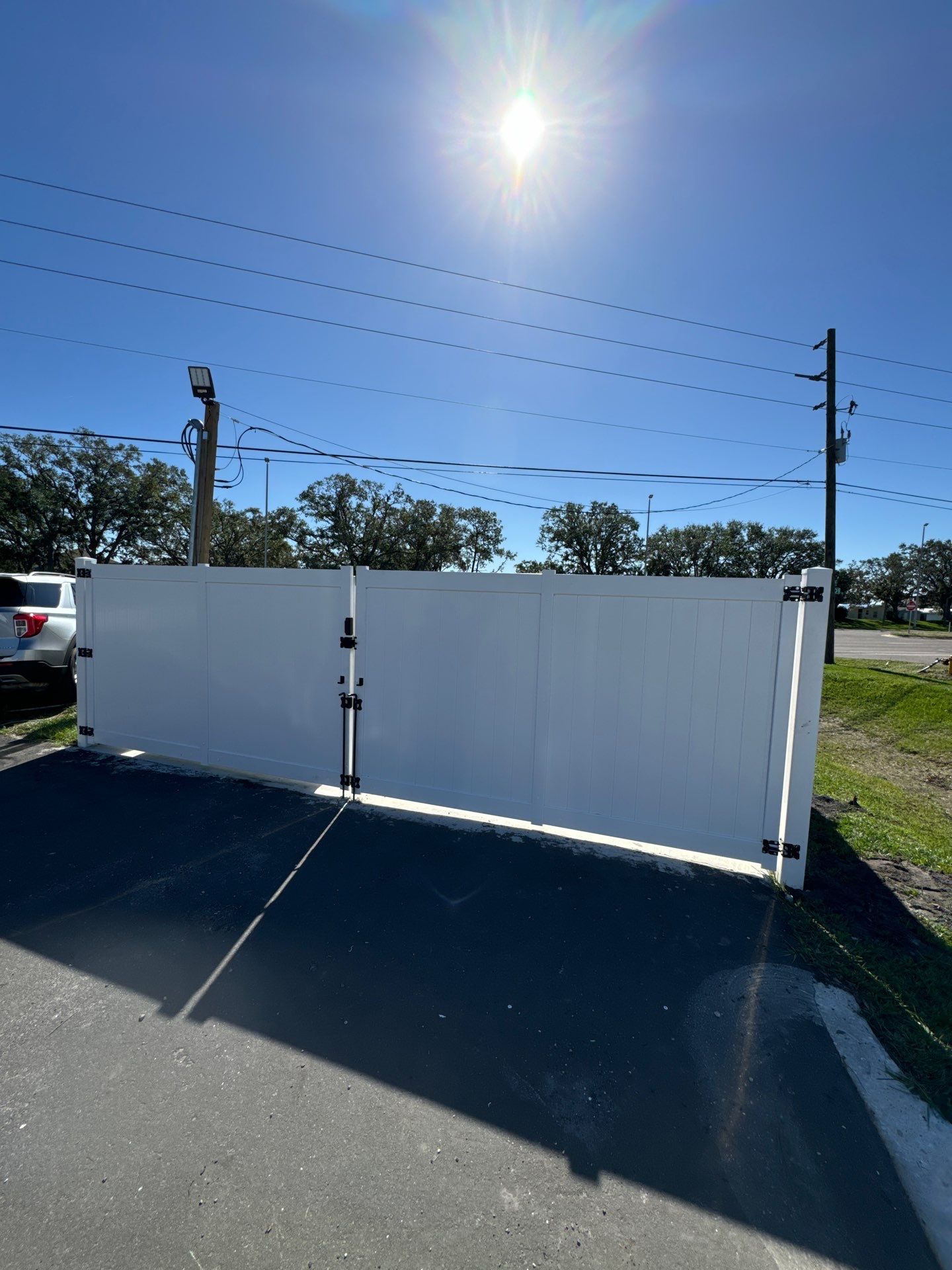 White vinyl dumpster gate - installed