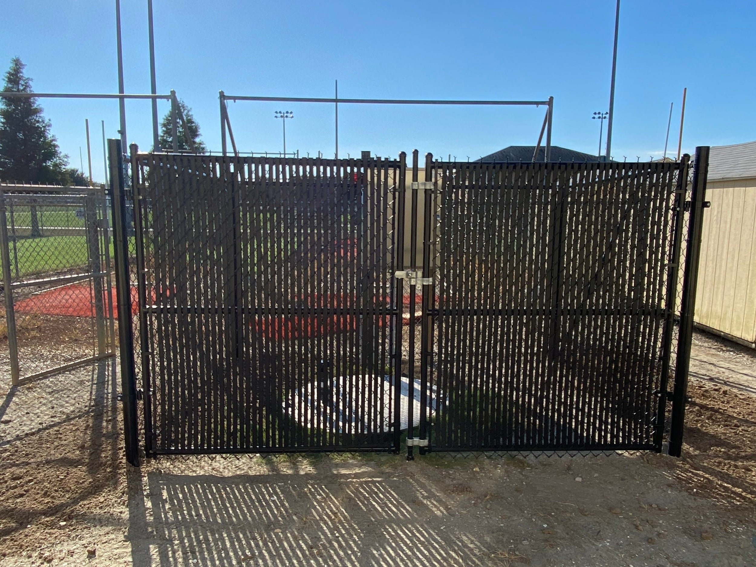 Black enclosure with gates open
