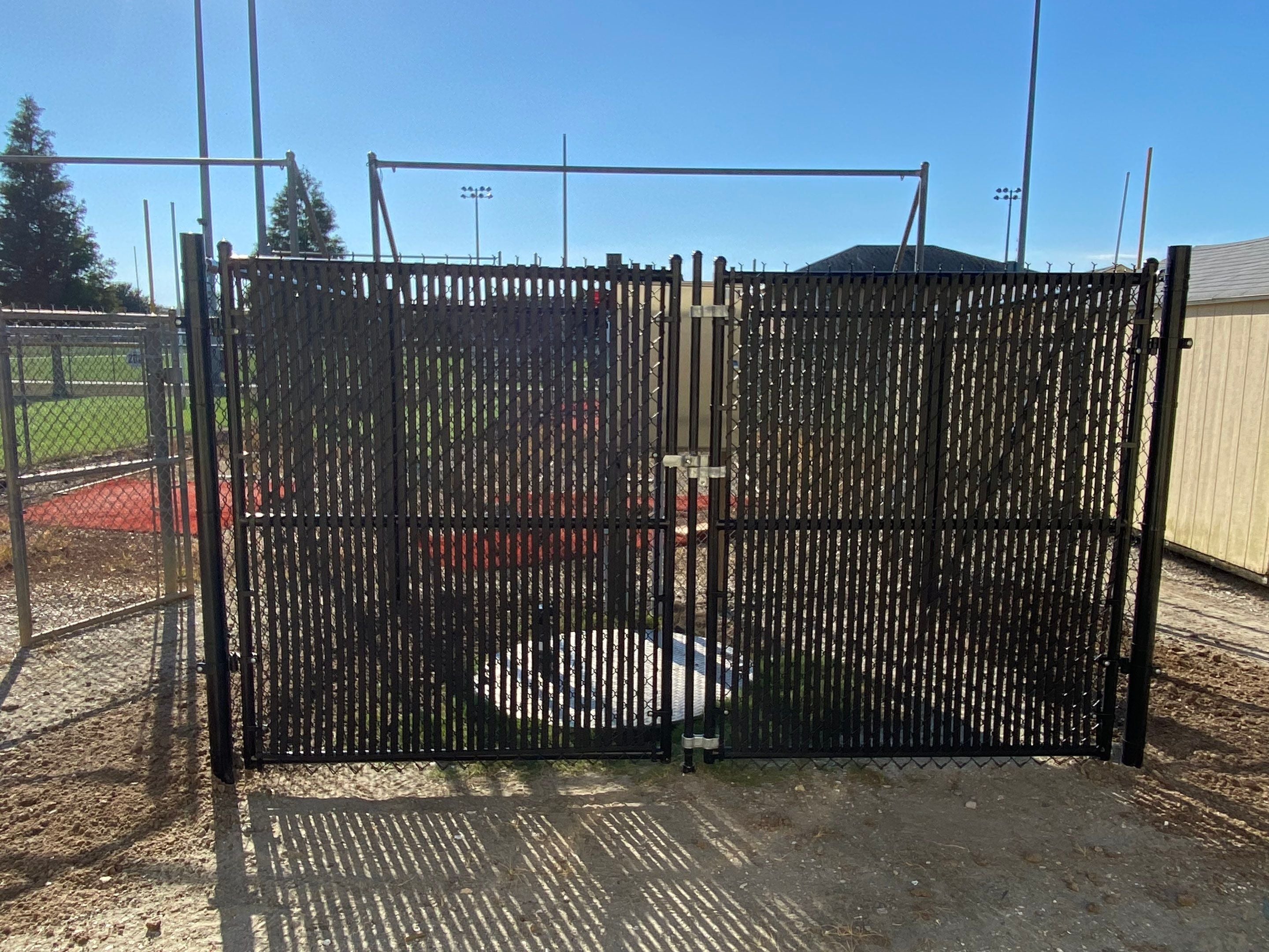 Black enclosure with gates open